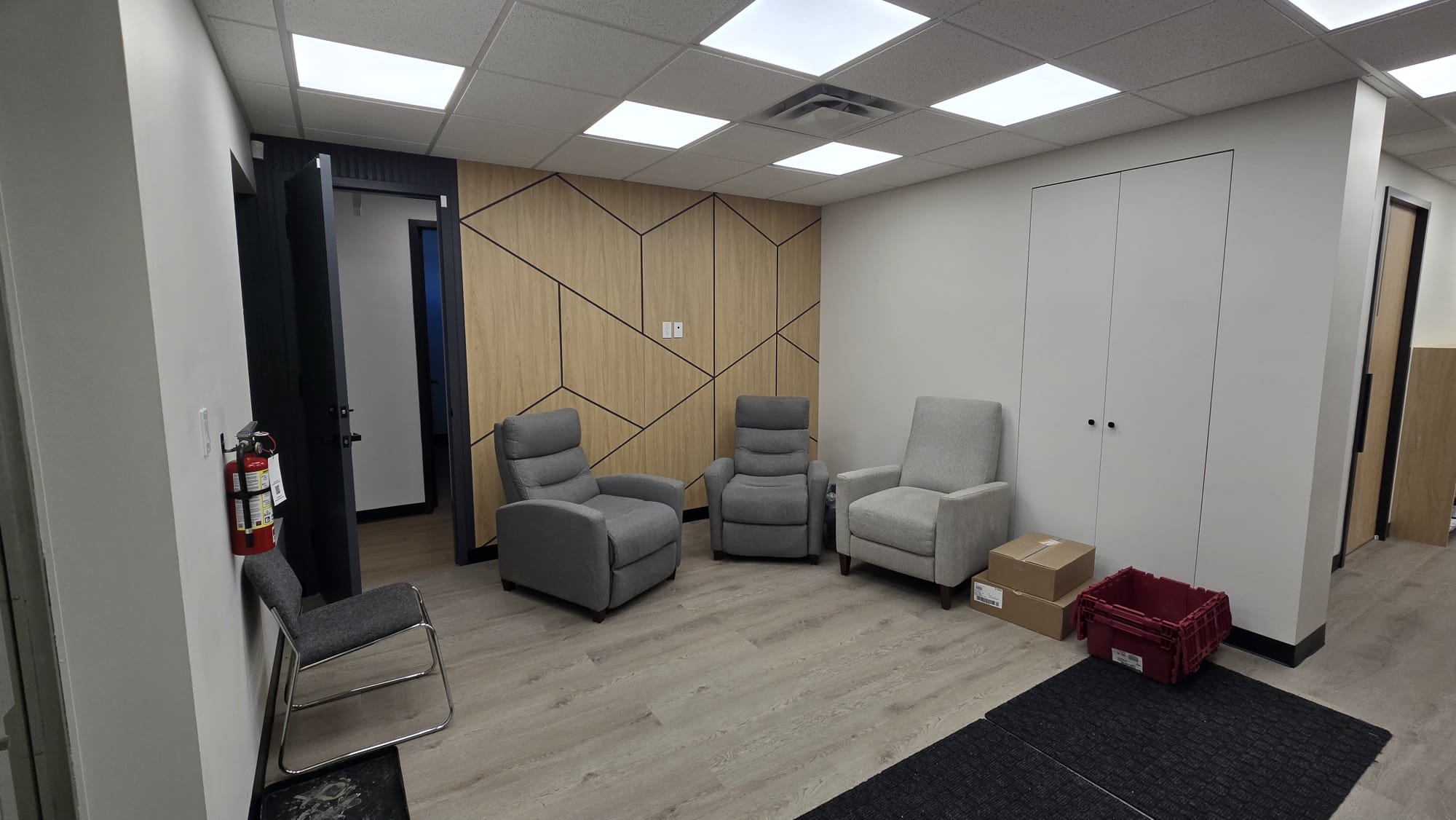 Bow Care Pharmacy consultation nook with geometric wood feature wall