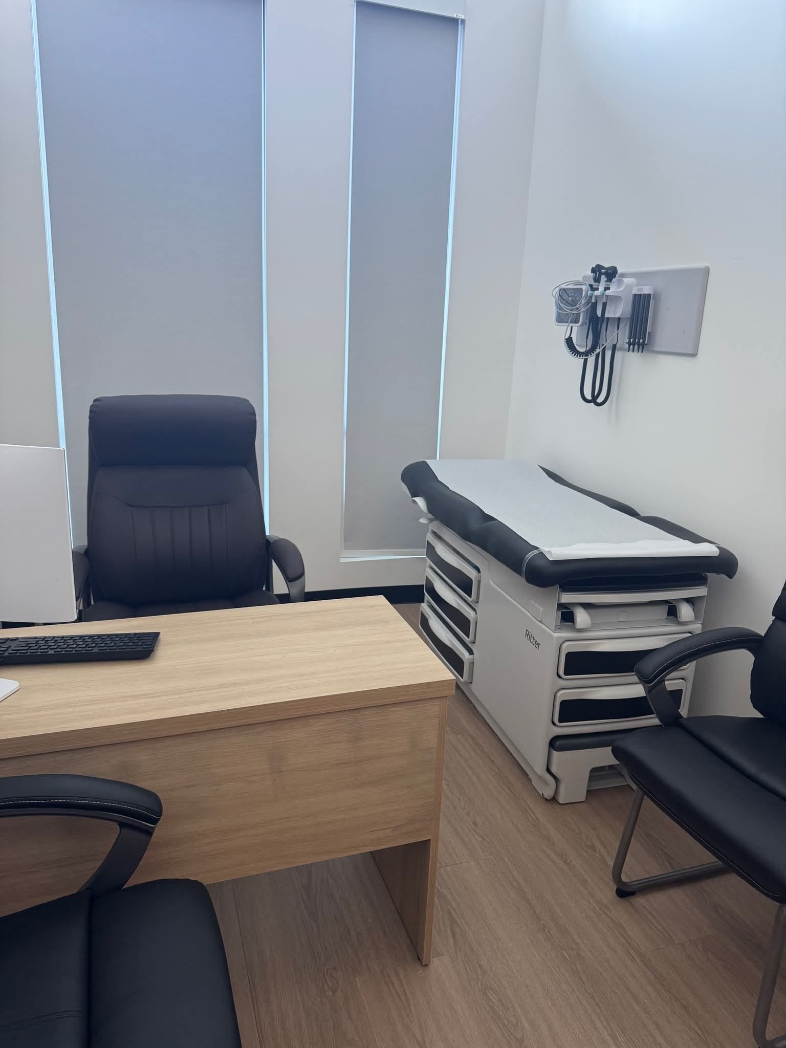 Grace Medical Clinic exam corridor with custom street-sign wayfinding