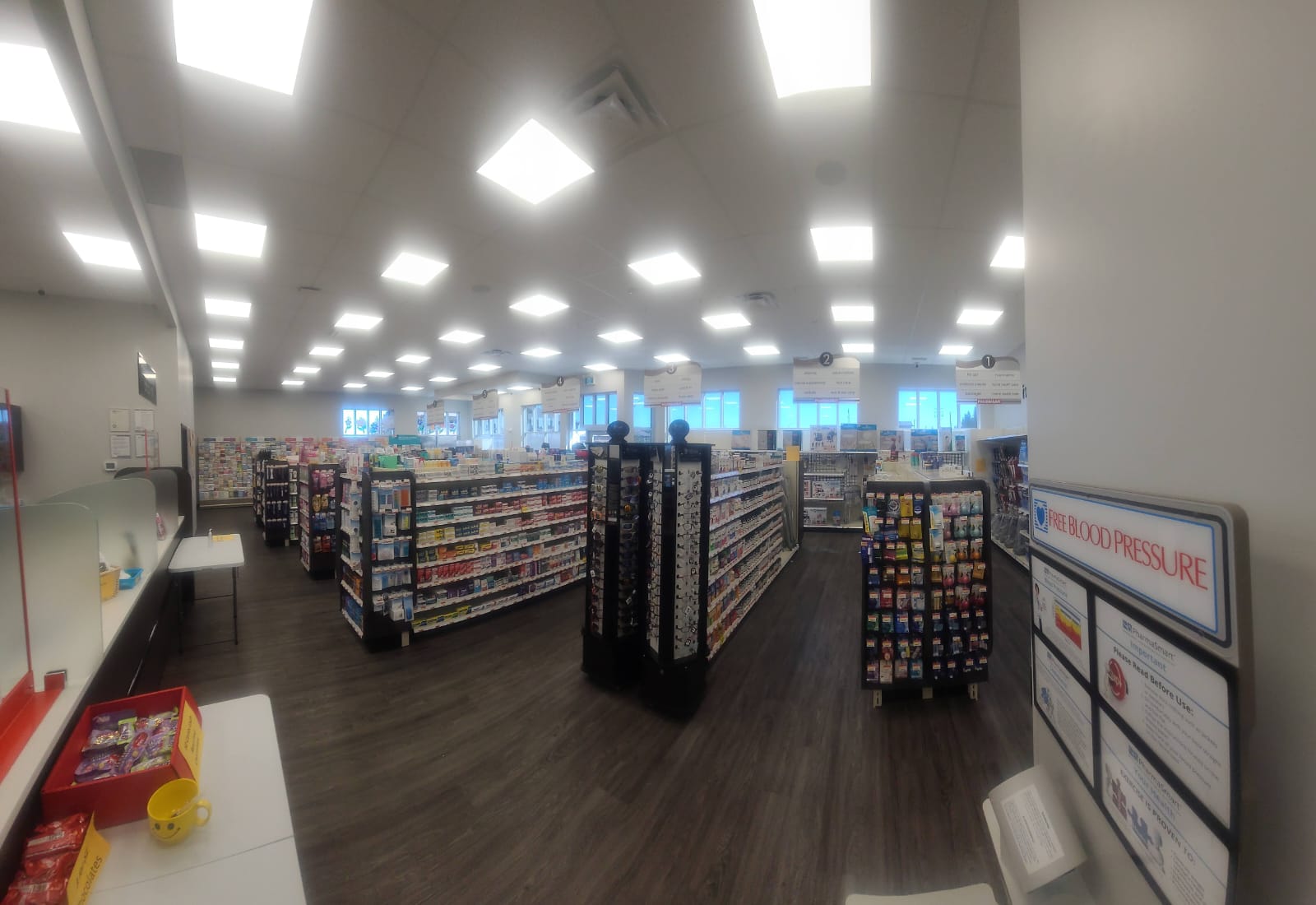 Pharmasave Sylvan Lake wide view of retail aisles and department signage