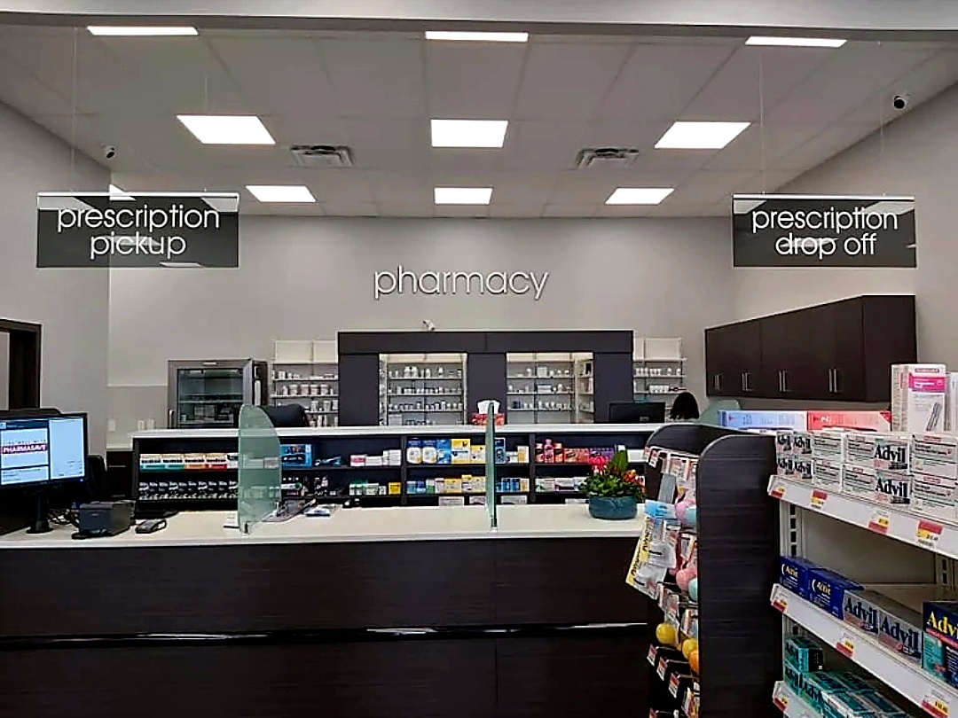 Pharmasave Sylvan Lake pharmacy counter with dispensary shelving
